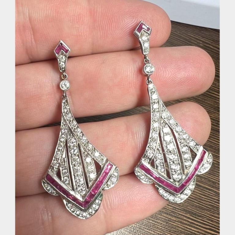 Platinum Ruby & Diamond Earrings: Item # 9211 Category Earrings Platinum Ruby & Diamond Earrings Weighing 13.2 grams Set with 80 Diamonds weighing app. 3.00 Ct. F-H Color, VS1-VS2 Clarity Along with 24 Rubies weighing app. 2.00 Ct. 2