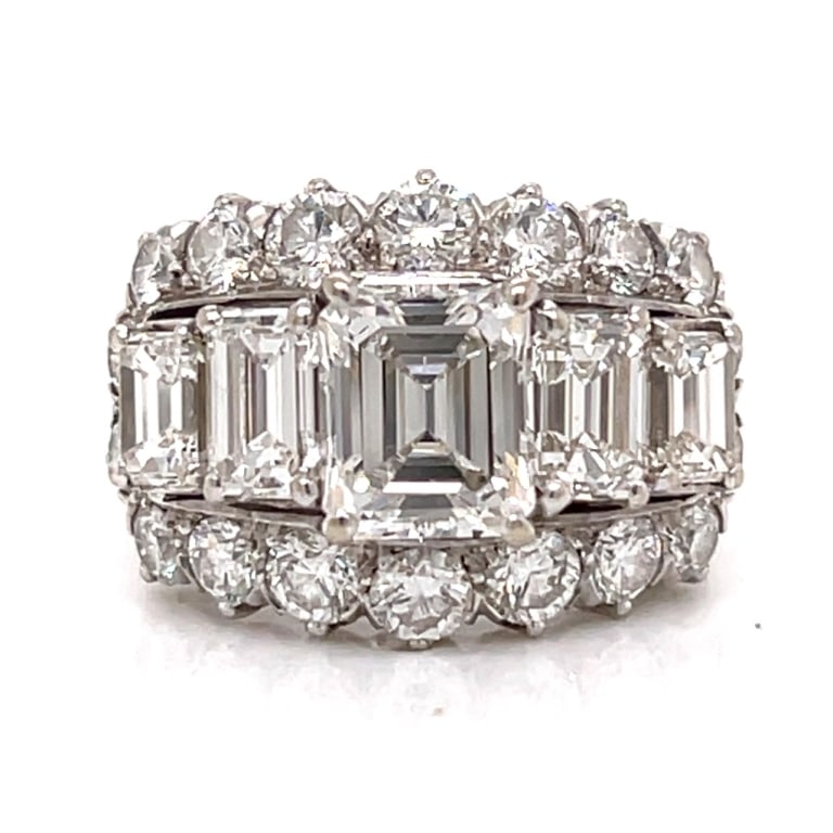 18K White Gold 5.35 Ct. Diamond Ring: Item # 13557 18K White Gold 5.35 Ct. Diamond Ring Weighing 8.6 grams Set with an app. 1.80 Ct. Emerald-cut Diamond D-E Color, VVS Clarity Along with 4 Emerald-cut Diamonds weighing app. 2.20 Ct. And