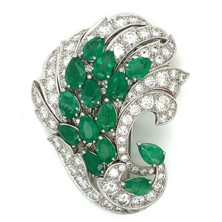 Platinum Emerald & Diamond Brooch: Item # 9893 Platinum Emerald & Diamond Brooch Weighing 26.8 grams Set with 14 Emeralds weighing app. 15.00 Ct. Along with 94 Diamonds weighing app. 10.70 Ct. F-G Color, VVS-VS Clarity 2 inches in