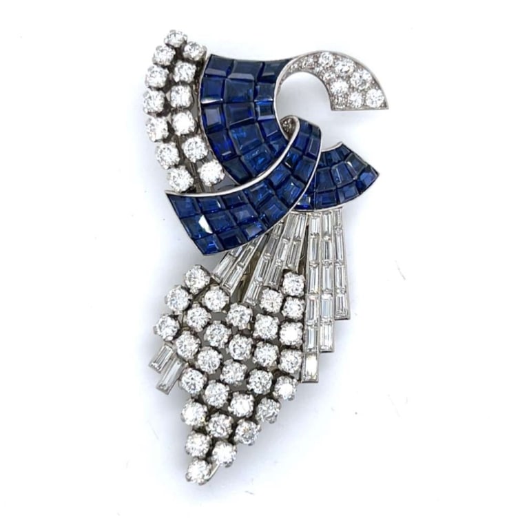 Art Deco Platinum Sapphire & Diamond Brooch: Item # 13214 Art Deco Platinum Sapphire & Diamond Brooch Weighing 25.9 grams Set with 45 Invisible Set Sapphires weighing app. 12.50 Ct. Along with 55 European-cut Diamonds weighing app. 6.80 Ct. And