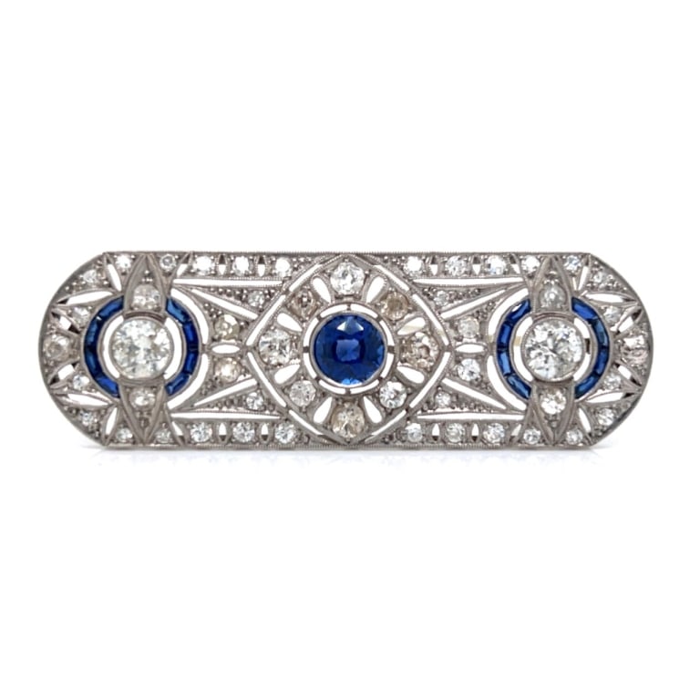 Art Deco Platinum Sapphire & Diamond Brooch: Item # 13203 Art Deco Platinum Sapphire & Diamond Brooch Weighing 12.4 grams Set with 2 European-cut Diamonds weighing app. 1.30 Ct. Along with 50 European-cut Diamonds weighing app. 2.00 Ct. G-I