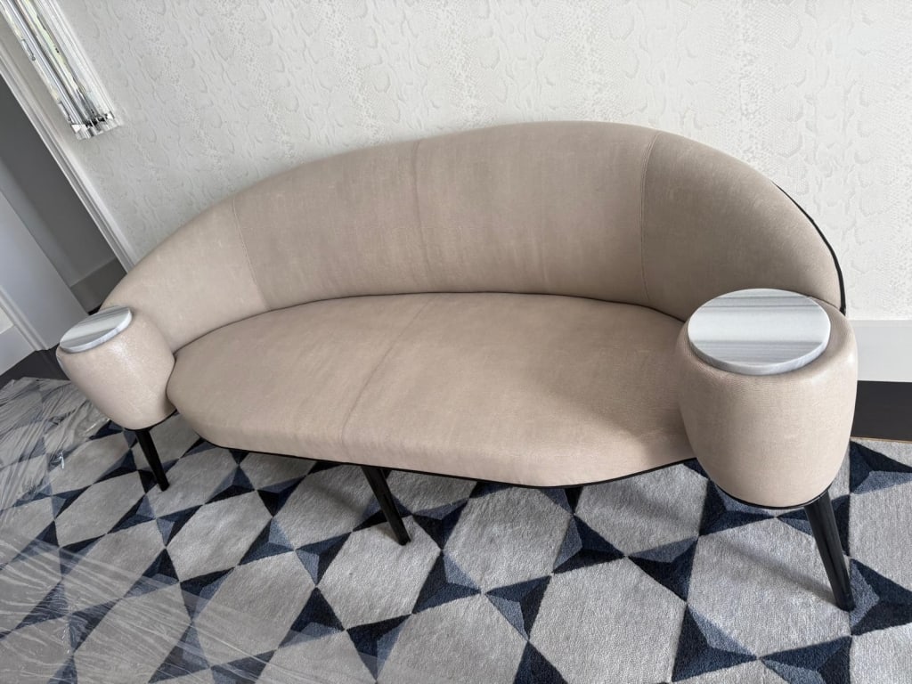 Entry sofa with integrate marble tables: Entry sofa with integrate marble tables upholstered in snake embossed lambs leather. Dimensions: Approx 7ft long PICK UP LOCATION - WEST LA, LOS ANGELES