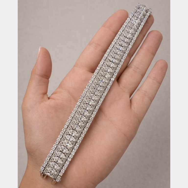 Art Deco Platinum 42.80 Ct. Diamond Bracelet: Item # 13641 Art Deco Platinum 42.80 Ct. Diamond Bracelet Weighing 76.6 grams Set with 40 Marquise Diamonds weighing app. 25.00 Ct. Along with 80 Trillions weighing app. 7.00 Ct. And 120 Round