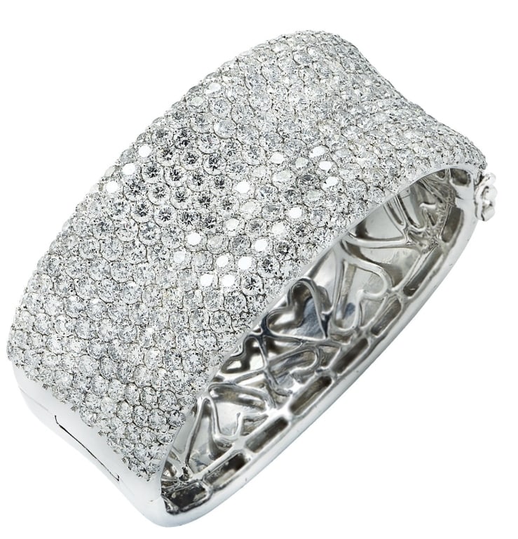 Stunning 27.72 Carat Diamond Bangle: VIVID Diamonds stunning 27.72 Carat Diamond Bangle - V41946 SKU: 41946 Command attention with this exquisite diamond bangle bracelet, a true masterpiece crafted in luxurious white gold and set with