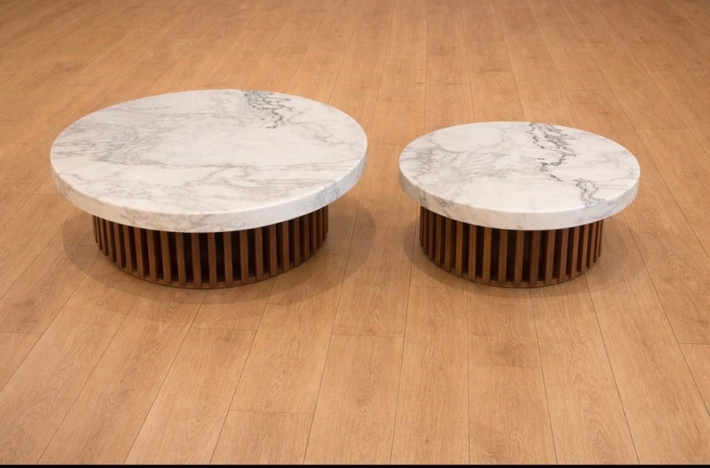 Pair (2) Dover white marble coffee tables: Pair (2) Dover white marble coffee table with walnut base Measures: 42" Diameter x 19" high 36" diameter x 16" high