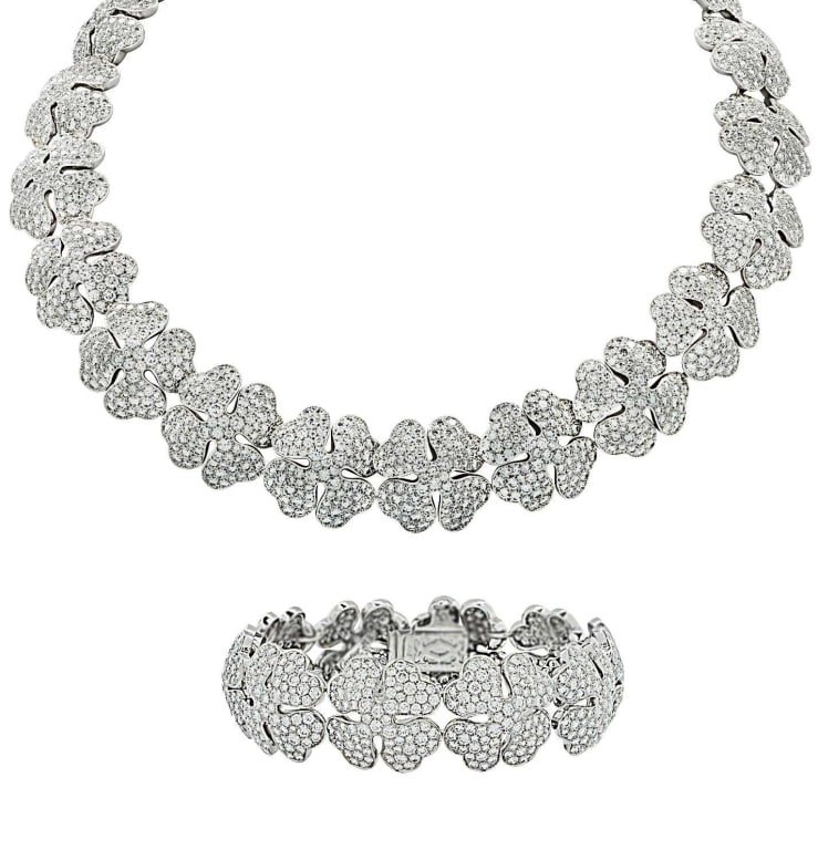 Cartier 18K White Gold Necklace & Bracelet Suite: Cartier 18K White Gold Pave Diamond Clover Necklace & Bracelet Suite - 2482 Diamonds, 54.32 Carats SKU: 45691 Exquisite sophistication of the Cartier Pave Diamond Clover Necklace and Bracelet Suite,