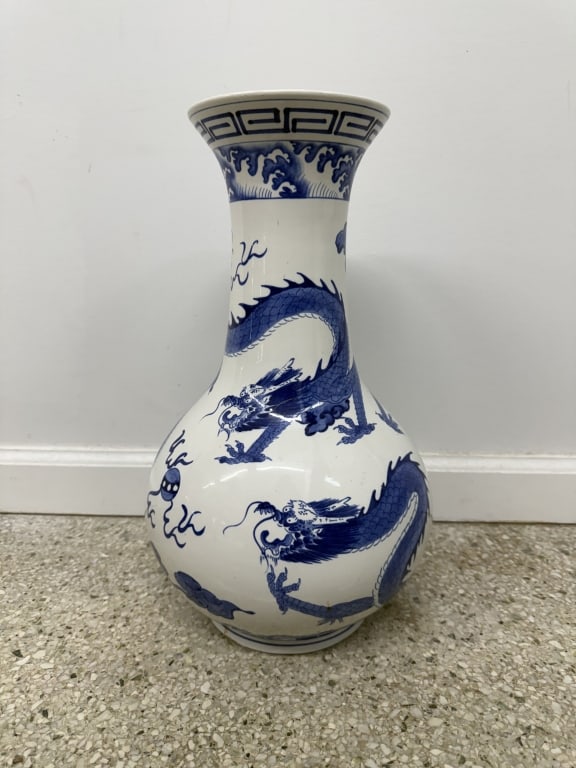 20th Century Chinese Porcelain Dragon Vase: Vintage 20th century Chinese porcelain dragon vase. Very faded stamp on underside. Gorgeous hand painted details all throughout. Some signs of wear and minor blemishing, otherwise in good condition.
