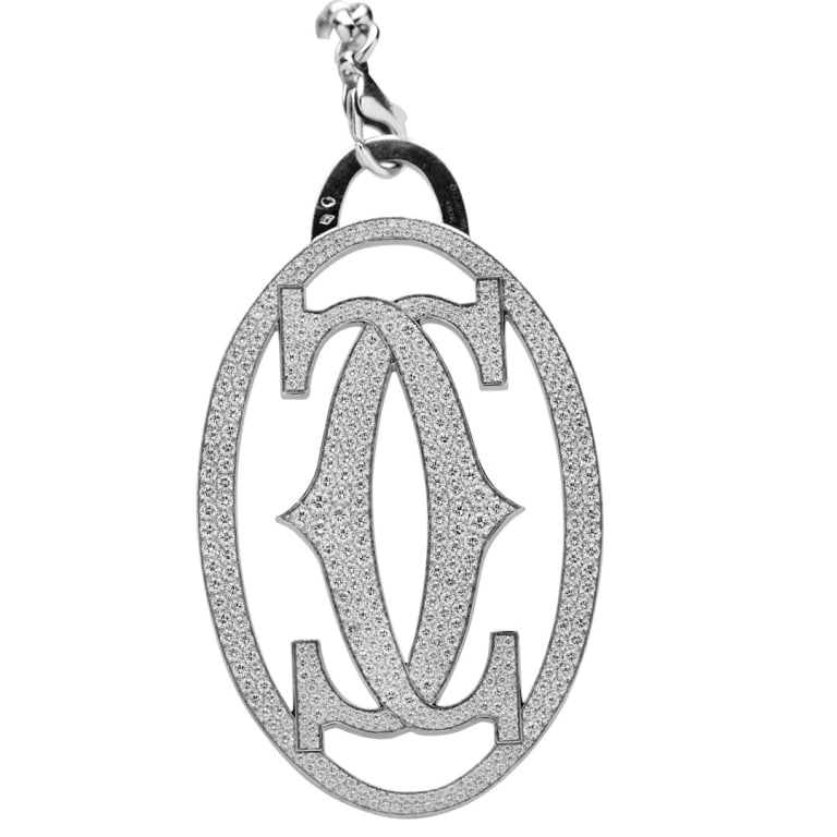 Cartier Diamond Charm: Cartier Diamond Charm - V53218 A striking expression of luxury and craftsmanship, this Cartier diamond charm is crafted in luminous 18k white gold and set with an impressive 14 carats of round brillia