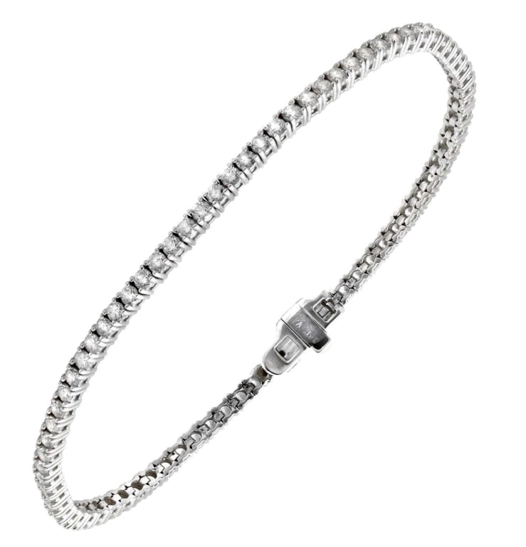 2.03 Ct 18K White Gold Diamond Tennis Bracelet: 2.03 Ct 18K White Gold Diamond Tennis Bracelet with 81 Brilliant Round Diamonds SKU: 43389 Elevate your elegance with the 2.03 Carat Diamond Tennis Bracelet – V43389. This exquisite piece is more th