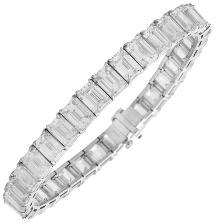 Platinum Diamond Bracelet: Elegant Platinum Diamond Bracelet with 34 Emerald Cut Diamonds, 34.16 Carats, VVS-VS Clarity SKU: 47863 A radiant composition of purity and geometric brilliance, this platinum bracelet is a modern hei