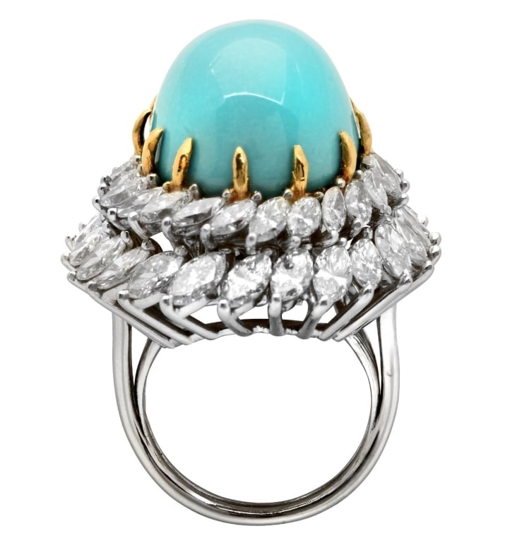 28.2 Carat Turquoise & 7.75 Carat Diamond Ring: 28.2 Carat Turquoise & 7.75 Carat Diamond Ring, Platinum & 18K Yellow Gold, Vivid Elegance SKU: 47845 This stunning 28.2 Carat Turquoise and 7.75 Carat Diamond Ring, fashioned from premium Platinum an