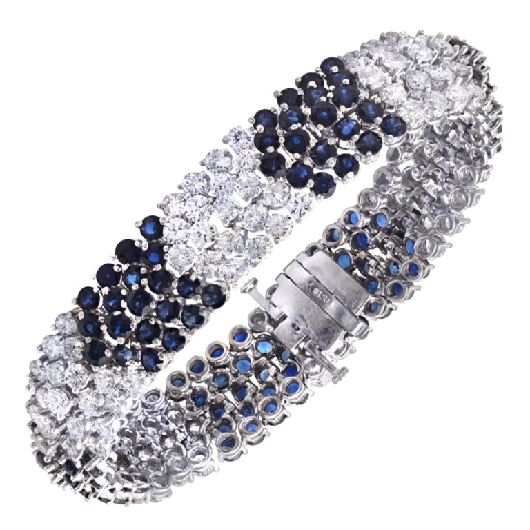 Platinum Diamond and Sapphire Bracelet: Platinum Diamond and Sapphire Bracelet -V52076 A refined expression of elegance and color, this platinum diamond and sapphire bracelet features a striking interplay of brilliance and deep blue hues. C
