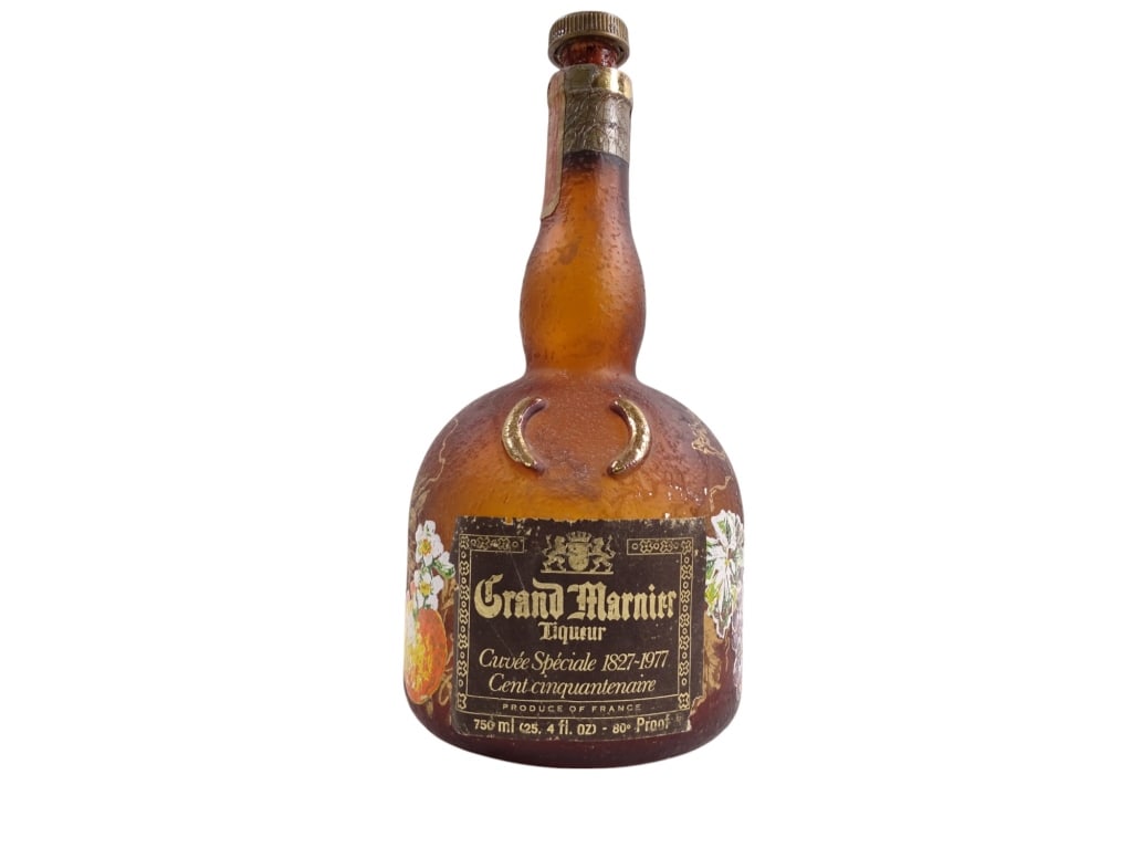 Grand Marnier Cuvee Speciale 1827-1977 Bottle: Vintage Grand Marnier Cuvee Speciale 1827-1977 Cent Cinquanten Bottle. Handpainted. Cameo Glass. No. 03440. Shows some signs of age, otherwise in good condition. 33910 20A