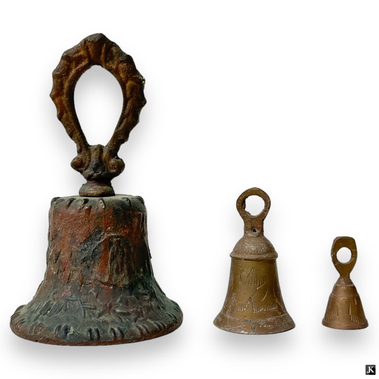3 Vintage Graduating Metal Bells One Marked Mexico: A collection of three bells crafted of metal. One with raised Mexico marks. Varying conditions, all show signs of age, otherwise in good condition. Tallest measures approx. 5 1/2" height. 3192 20A