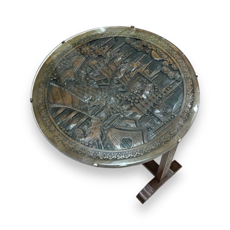 Vintage Chinese Relief Carved Scenic Folding Table: A vintage Chinese carved wooden folding top table. Has intricate relief carved top depicting a village scene with glass cover. Measures approx. 32 3/4" height with top verticle x 26 1/4" widht x 11 1/
