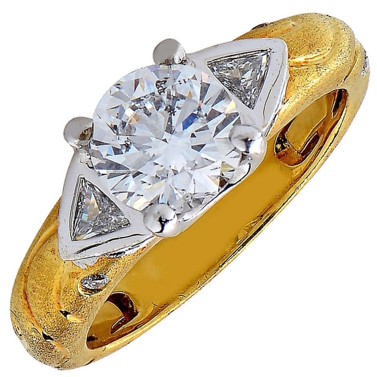 1.50ct Diamond Engagement 18k Yellow Gold Ring: 1.50ct Diamond Engagement 18k Yellow Gold Ring -V25346-1 A radiant expression of timeless elegance, this 18k yellow gold diamond engagement ring is centered by a stunning 1.50-carat round brilliant di