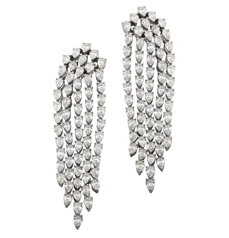 Elegant 18K White Gold Diamond Dangle Earrings: Elegant 18K White Gold Diamond Dangle Earrings with 6.00 Carats Pear-Shaped Diamonds SKU: 48889 Adorn yourself with the epitome of elegance. These stunning Diamond Dangle Earrings, crafted in lavish