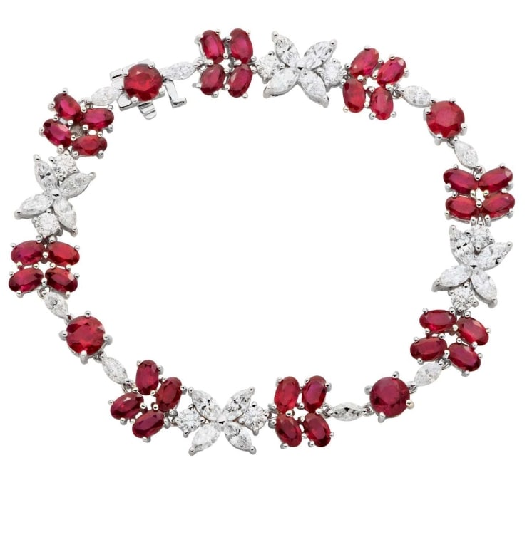 Ruby & Diamond Floral Bracelet in 18K White Gold: Exquisite Ruby & Diamond Floral Bracelet in 18K White Gold, 13.37 Carats Rubies & 4.75 Carats Diamonds SKU: 47822 This stunning Ruby & Diamond Floral Bracelet in 18K White Gold is more than just jewel