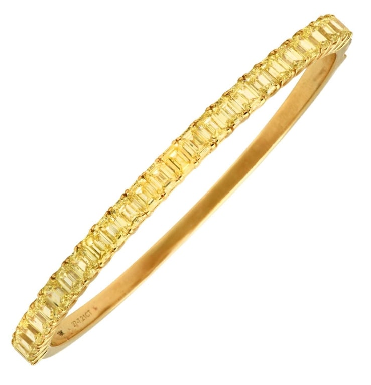 18K Yellow Gold Fancy Yellow Diamond Bracelet: Exquisite 18K Yellow Gold Fancy Yellow Diamond Bracelet – 7.21ct Emerald-Cut Elegance SKU: 48921 Indulge in the exquisite charm of our Fancy Yellow Diamond Bracelet, crafted in luxurious 18K yellow