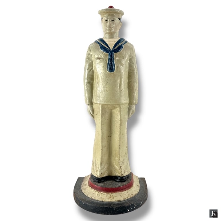 1930's Cast Iron Sailor Doorstop: 1930's Cast Iron Sailor Doorstop. Unmarked. The paint appears original and is in overall good condition consistent with age and use. Measures 13-1/2" H. 33646 8A