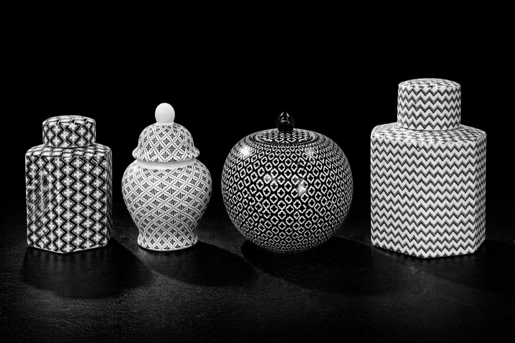 (4) Four Covered Urns: (4) Four Covered Urns. Smallest measures 8 1/2 inches high, largest 12 inches high