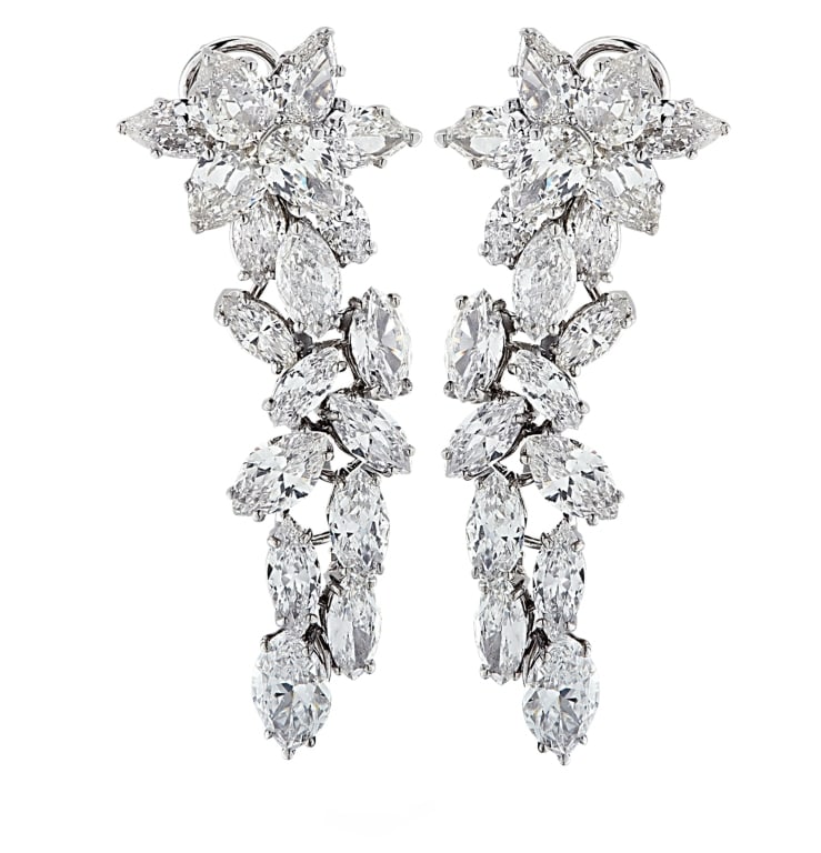 14 Carat Diamond Dangle Earrings: 14 Carat Diamond Dangle Earrings -V24879-1 SKU: 24879-1 A striking display of brilliance and movement, these dangle earrings are the epitome of timeless elegance and craftsmanship. Handcrafted in 18k