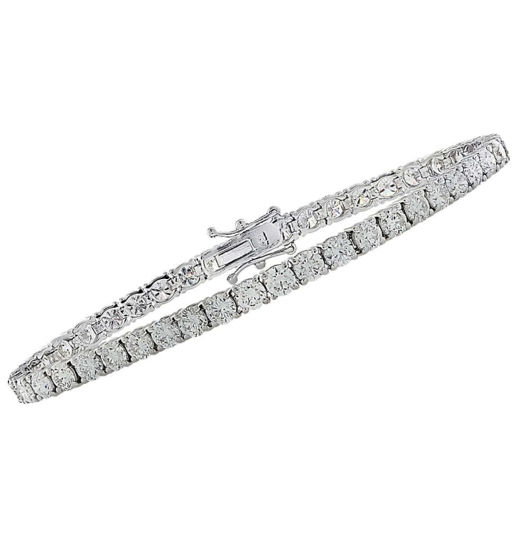 GIA Certified 14.57 Carat Diamond Tennis Bracelet: GIA Certified 14.57 Carat Diamond Tennis Bracelet -V36671-1 SKU: 36671-1 A timeless symbol of sophistication, this GIA Certified Diamond Tennis Bracelet embodies elegance, precision, and lasting