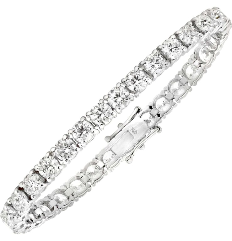 18k White Gold Diamond Tennis Bracelet: 18k White Gold Diamond Tennis Bracelet - V50551-1 SKU: 50551-1 A classic icon of elegance, this diamond tennis bracelet is the epitome of refined luxury. Thirty-one round brilliant diamonds shimmer