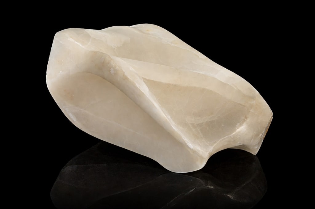 Carved alabaster sculpture: Carved alabaster sculpture . Measures 13 inches length.