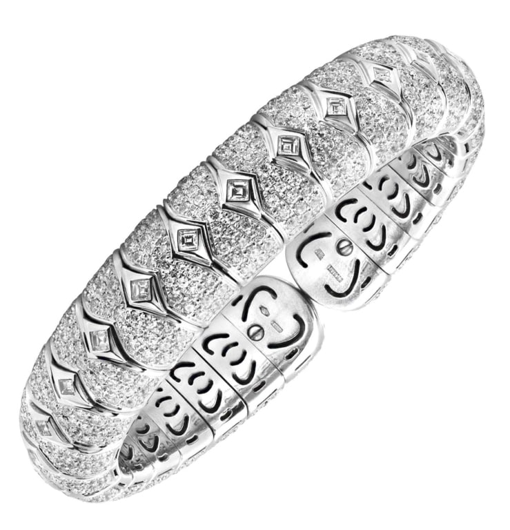 Bvlgari Diamond Bangle: Bvlgari Diamond Bangle - V51210 SKU: 51210 A striking testament to Italian elegance, this Bvlgari diamond bangle captures the brand’s signature balance of bold design and refined brilliance. Crafted