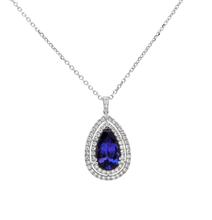 Oval Tanzanite & Diamond Pendant Necklace: Oval Tanzanite & Diamond Pendant Necklace – V50911 SKU: 50911 A captivating fusion of rare color and radiant brilliance, this 14k white gold necklace features a 5.09-carat oval tanzanite at its cent