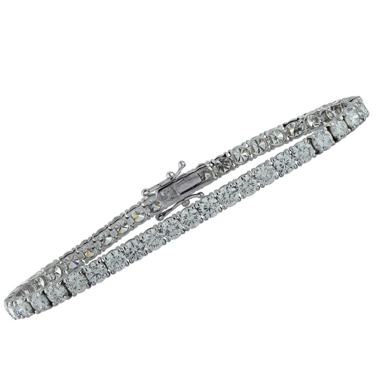 10.40 Carat White Gold Tennis Bracelet: 10.40 Carat White Gold Tennis Bracelet with 44 Brillant Cut Diamonds SKU: 37802 Indulge in the elegance of the 10.40 Carat Diamond Tennis Bracelet. This exquisite piece is a true statement of luxury,