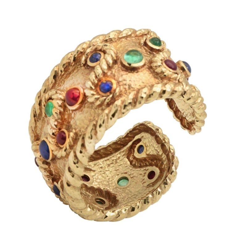 David Webb 18K Yellow Gold Cuff Bangle Bracelet: David Webb 18K Yellow Gold Cuff Bangle Bracelet with 6 Emeralds, 8 Rubies & 6 Sapphires SKU: 48552 Step into a world of luxury with the stunning David Webb Sapphire, Emerald, and Ruby Cabochon Cuff