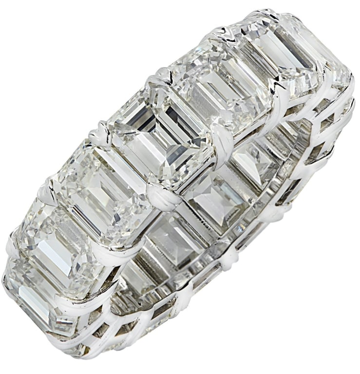 15.2 Carat Emerald Cut Diamond Eternity Band: 15.2 Carat Emerald Cut Diamond Eternity Band in Platinum – Timeless Luxury SKU: 38479 Discover the elegance of the 15.2 Carat Emerald Cut Diamond Eternity Band, a breathtaking symbol of eternal