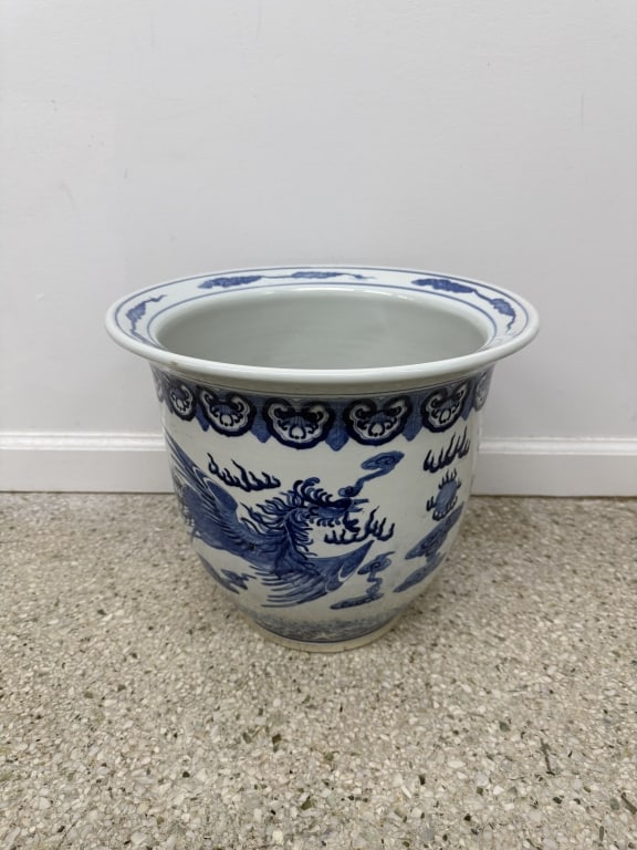 Vintage Chinese Oriental Porcelain Planter: Vintage 20th Century Chinese oriental porcelain dragon and phoenix planter. No make or marks. Signs of wear and minor chipping, discoloration on inside, hole cutout on bottom, otherwise in good