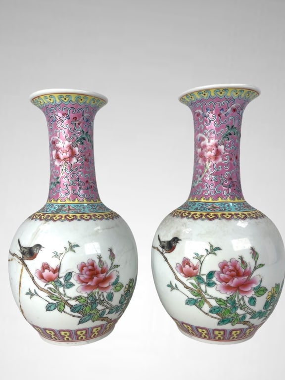Pair of Chinese Famille Rose Bird Vases: Pair of Chinese Famille Rose Bird Vases. Porcelain Lotus Blossom Design. One Cracked/ Repaired, both show signs of age and use, otherwise in good condition. Each Measures 10 inches high x 5 inches