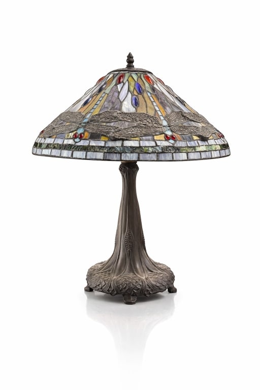 Tiffany Studios Bronze Dragonfly Glass Shade Lamp: A Tiffany Studios style bronze base table lamp with green dragonfly motif slag glass shade. Some signs of wear, age and holes in the glass, otherwise in good condition. Cannot guarantee functionality