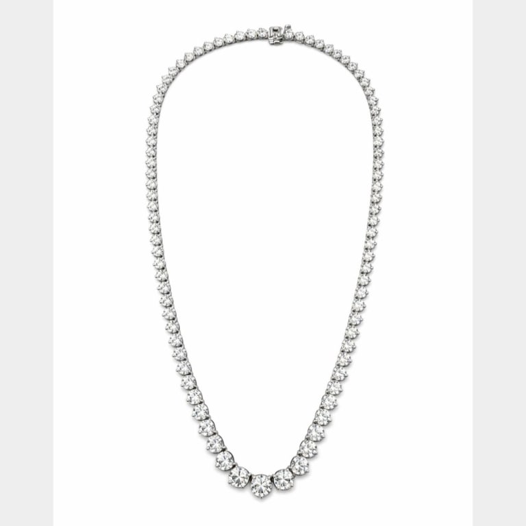 14K Gold 23.25 Ct. Graduated Diamond Necklace: 14K White Gold 23.25 Ct. Graduated Diamond Tennis Necklace Item # 13774 Category Necklaces 14K White Gold 23.25 Ct. Graduated Diamond Tennis Necklace Weighing 26.6 grams Set with 103 Diamonds weighing