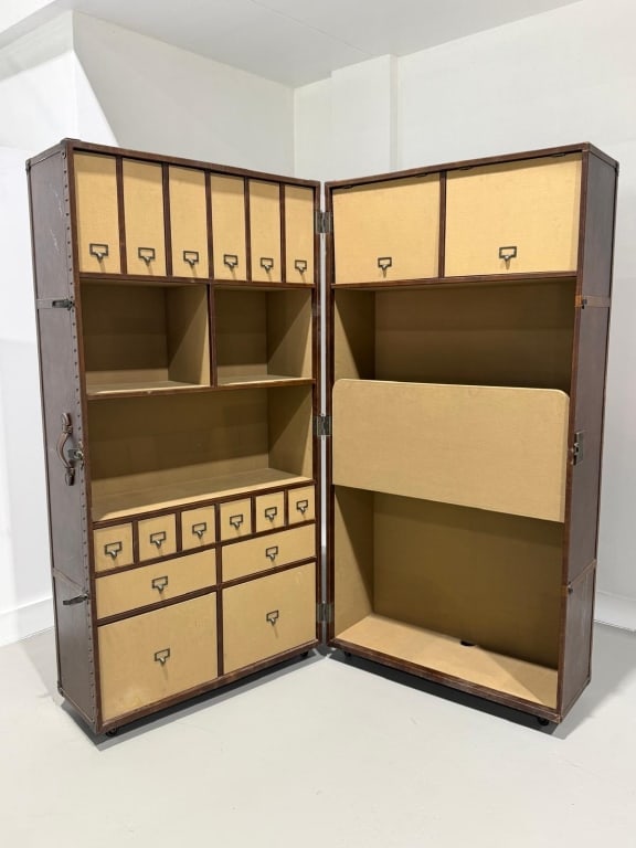 A restoration hardware leather trunk desk: A restoration hardware leather trunk desk, perfect for corner of a home Measures: Fully open measures 77 wide, each selection 38 inches wide x 14 deep Measures 75 1/2 inches high