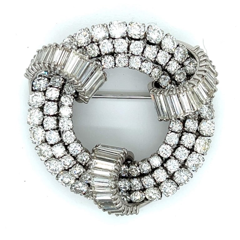Art Deco Platinum 24.00 Ct. Diamond Brooch: Item # 9952 Art Deco Platinum 24.00 Ct. Diamond Brooch Weighing 40.1 grams Set with 94 Diamonds weighing app. 16.50 Ct. Along with 45 Baguette Diamonds weighing app. 7.50 Ct. E-G Color, VVS-VS Clarity