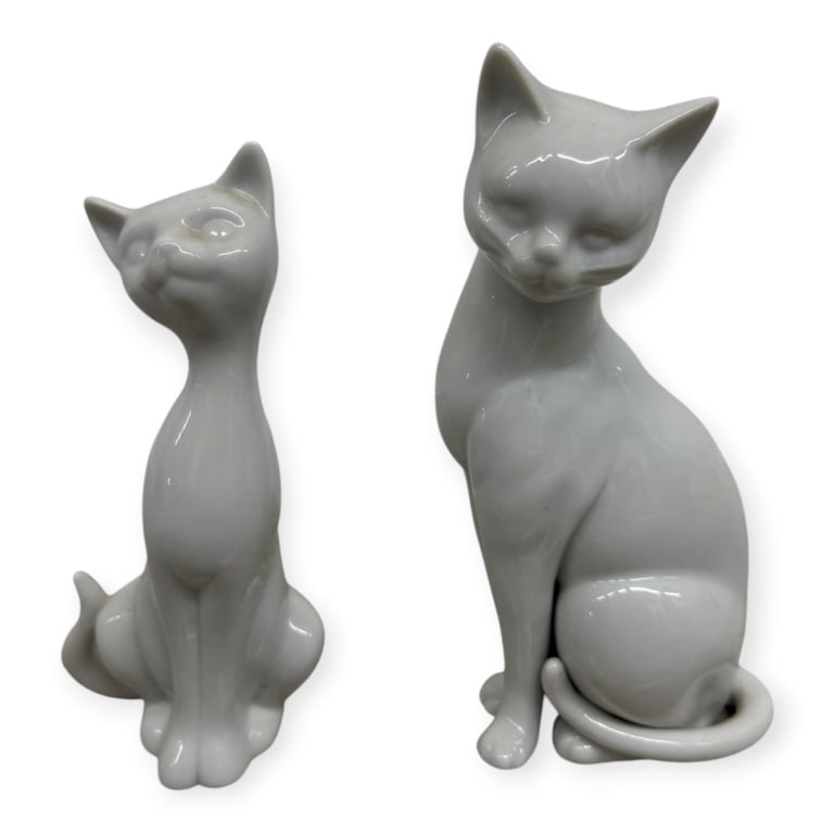 Pair Vintage Porcelain Cat Figures: Pair Vintage Porcelain Cat Figures. Both unmarked. Both pieces show signs of age and wear, otherwise in good condition. Larger piece measures approx. 8 1/4" height 2B