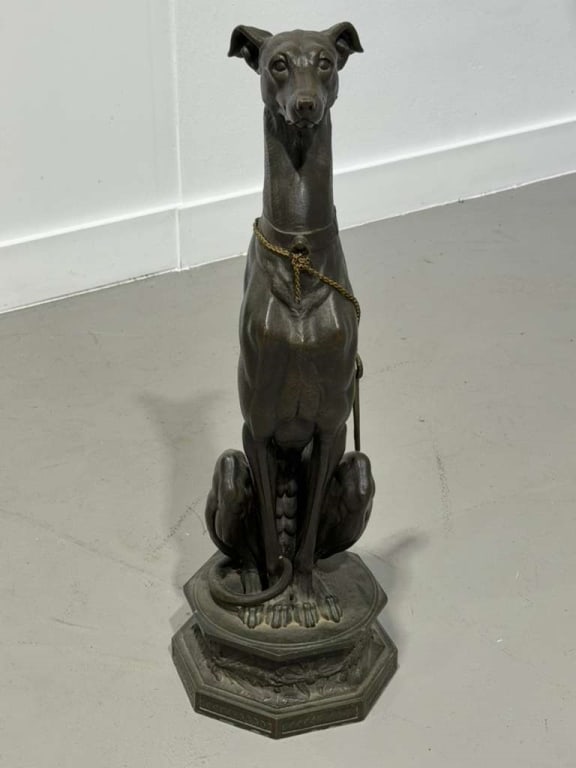 P. Poitevin Attributed Seated Greyhound Sculpture: Philippe Poitevin (French, 1831–1907) Attributed Seated Greyhound Sculpture Elegant patinated metal sculpture depicting a seated greyhound with elongated naturalistic form and collar detail,