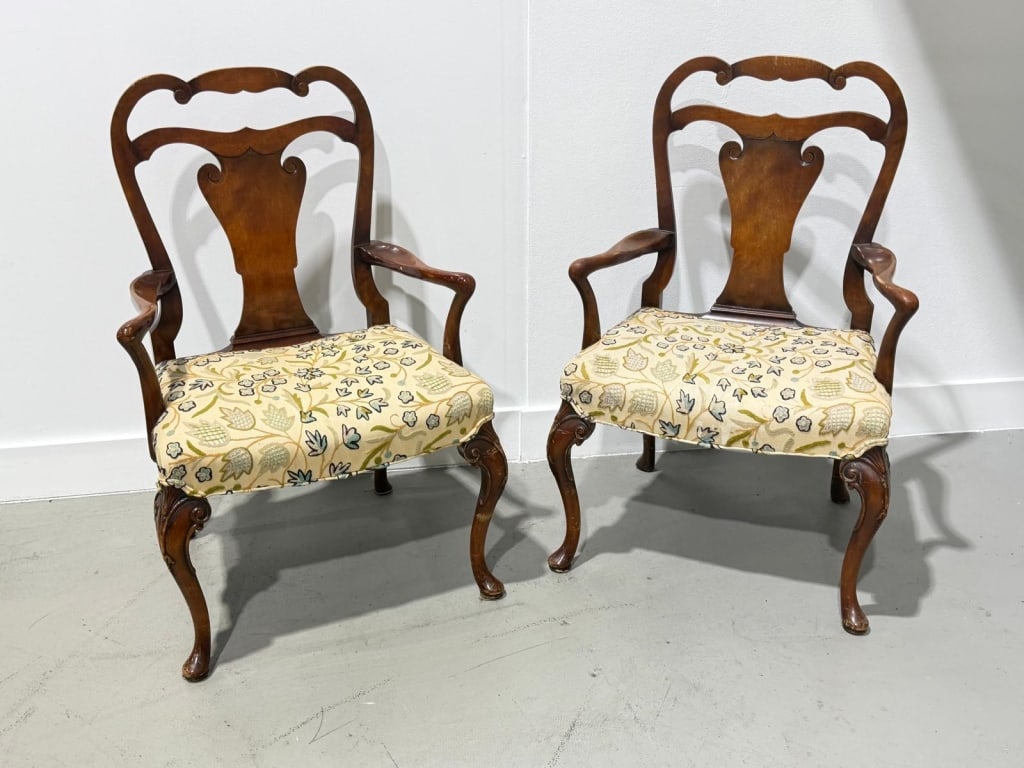 A pair of antique carved arm chairs. (1 of 5)