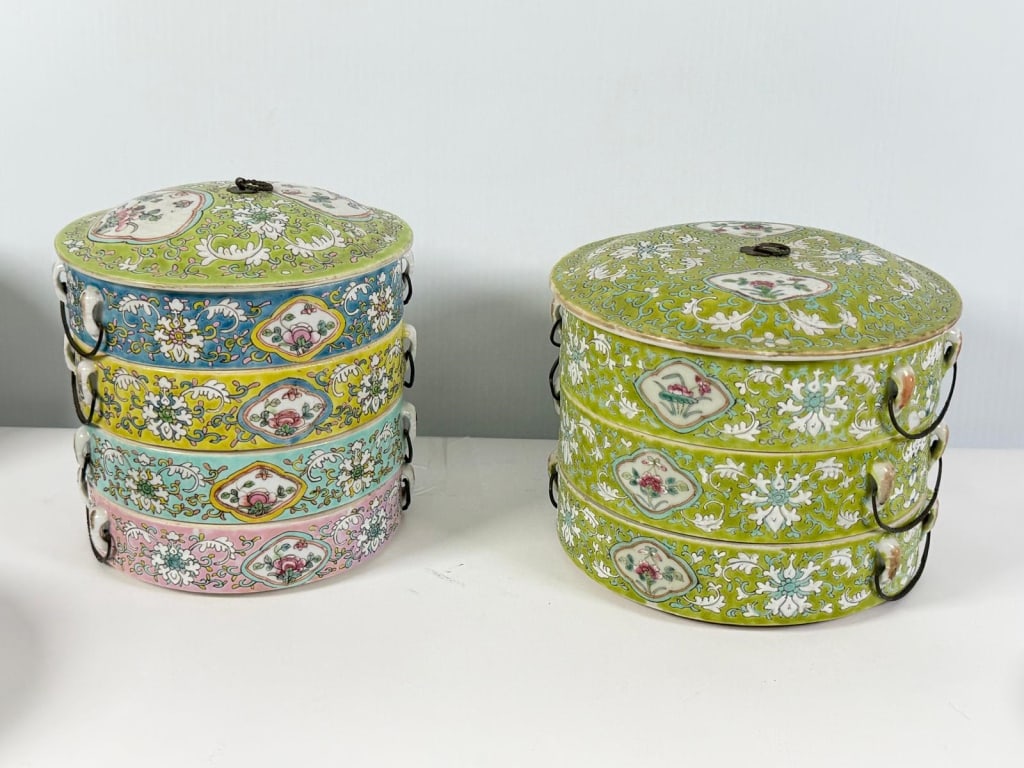 A pair of Chinese stacked porcelain jars.: A pair of Chinese stacked porcelain jars. Beautiful color flowers Measures: one measure 6” x 8” diameter the other one measures 7 1/2” x 7” diameter JZ2A