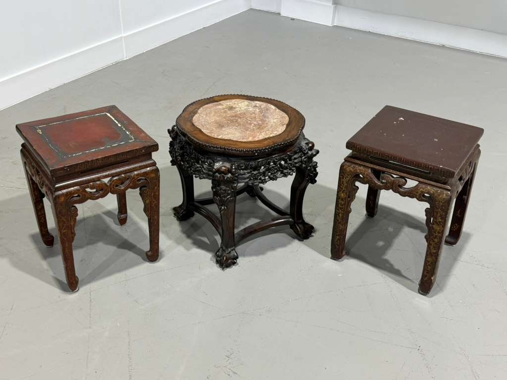 Lot of Three Asian Hardwood Stands/Tables: Lot of Three Asian Hardwood Stands/Tables Group of three carved hardwood display stands comprising two square-form tables and one circular pedestal stand with inset marble top. Featuring decorative op