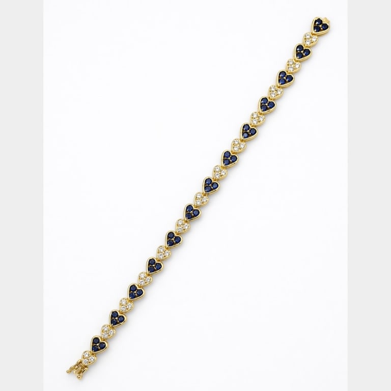 18K Yellow Gold Diamond & Sapphire Heart Bracelet: Item # 13897 Category Bracelets 18K Yellow Gold Diamond & Sapphire Heart Bracelet Weighing 17.7 grams Set with 39 Diamonds weighing app. 3.10 Ct. G-H Color, VVS-VS Clarity Along with 39 Sapphires