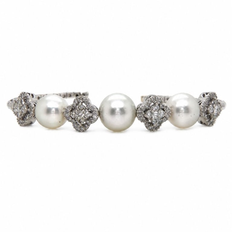 18K White Gold Diamond & South Sea Pearl Bracelet: Item # 14097 Category Bracelets 18K White Gold Diamond & South Sea Pearl Bracelet Weighing 22.1 grams Set with 3 South Sea Pearls Measuring 11.3-10.1mm Along with 100 Diamonds totalling app. 1.80cts F