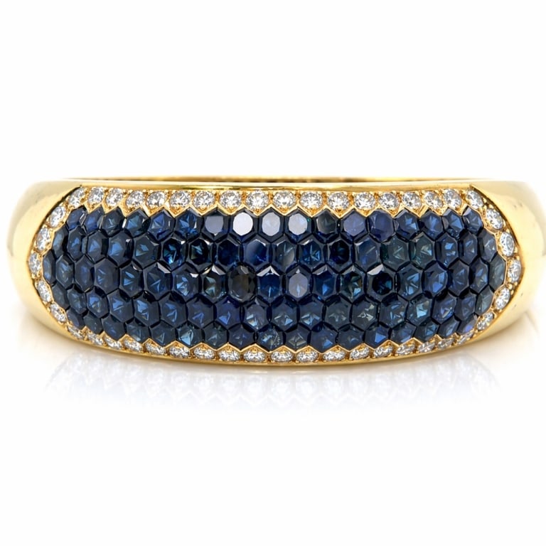 18K Yellow Gold Sapphire & Diamond Bangle Bracelet: Item # 13943 Category Bracelets 18K Yellow Gold Sapphire & Diamond Bangle Bracelet Weighing 80.8 grams Set with 89 Sapphires weighing app. 22.00 Ct. Along with 46 Diamonds weighing app. 3.20 Ct. F-G C