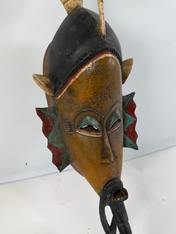 An African carved wood figure polychrome painted (1 of 7)