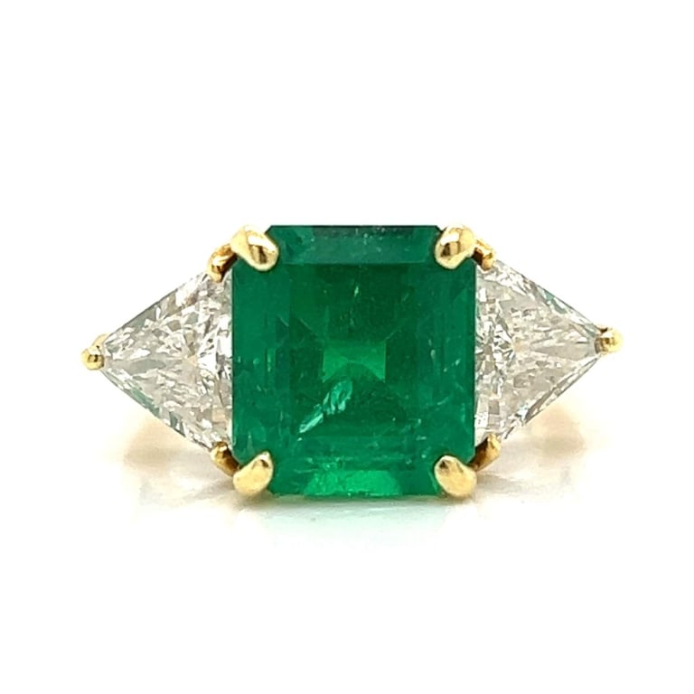 18K Gold 5.10 Ct. Emerald and Diamond Ring: 18K Yellow Gold 5.10 Ct. Colombian Emerald and Diamond Ring Item # 8009 Category Rings 18K Yellow Gold 5.10 Ct. Colombian Emerald and Diamond Ring Weighing 5.7 grams Set with an app. 5.10 Ct.